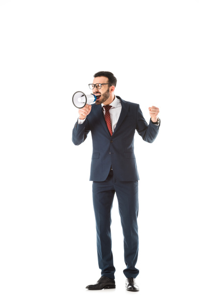 angry businessman screaming in megaphone and showing fist isolated on white - Foto, imagen