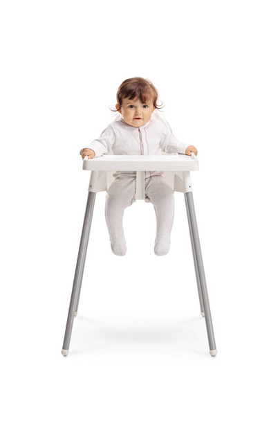Baby girl sitting in a feeding chair  - Φωτογραφία, εικόνα