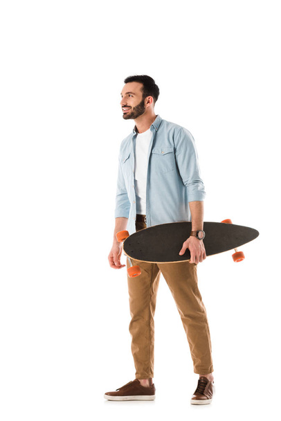 happy man with longboard smiling and looking away isolated on white - Photo, image