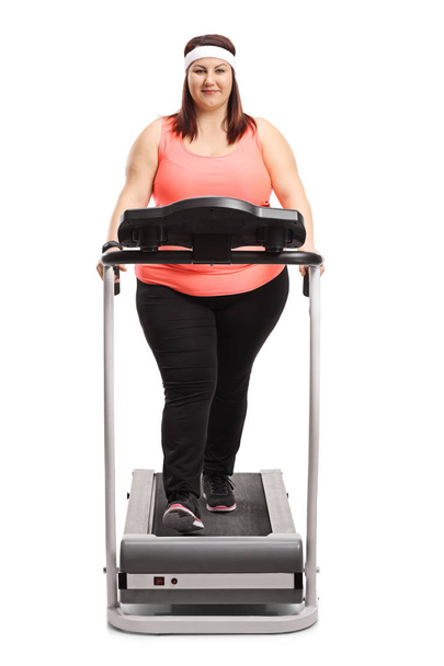Chubby woman on a treadmill - Photo, Image