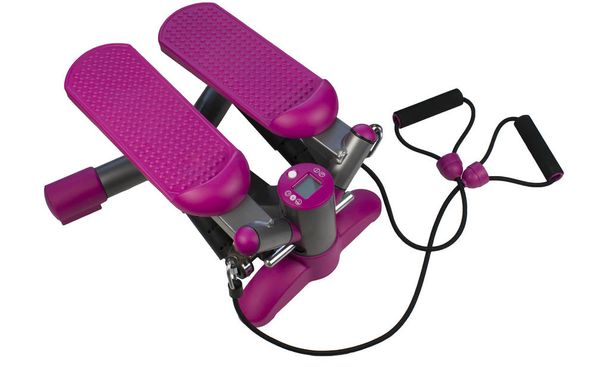 Geïsoleerde Fitness machine, roze stepper op witte achtergrond. Air stepper. - Foto, afbeelding