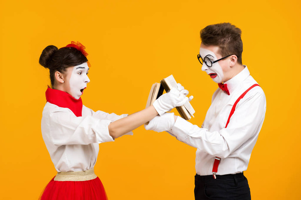 portrait of mime couple artist with book - Photo, image