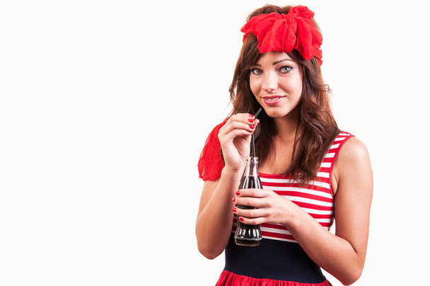 a young beautiful girl old-fashioned, drink soda through a straw - Foto, Imagen