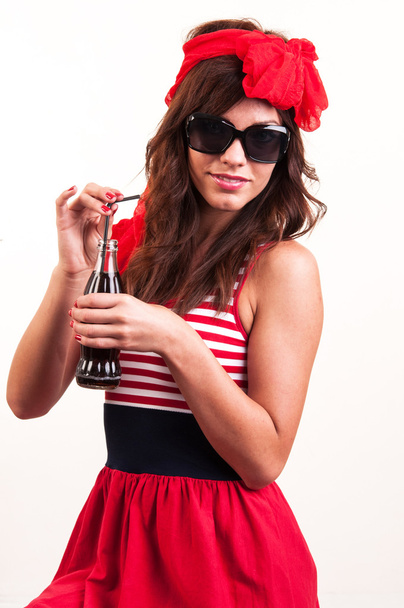 a young beautiful girl old-fashioned, drink soda through a straw - Foto, Imagen