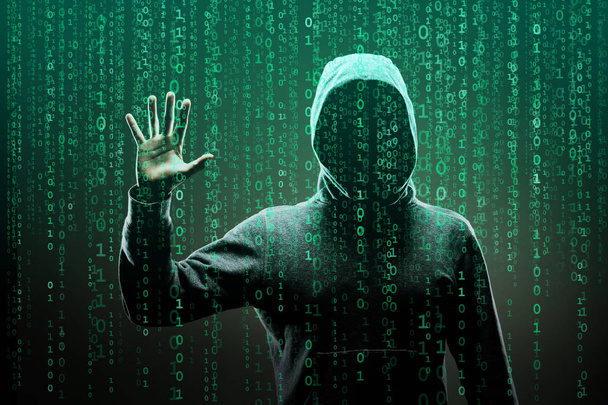 Computer hacker in mask and hoodie over abstract binary background. Obscured dark face. Data thief, internet fraud, darknet and cyber security concept. - Fotoğraf, Görsel