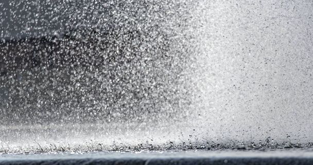 splashes of falling water from the city fountain of the city of the Dnieper - Photo, Image