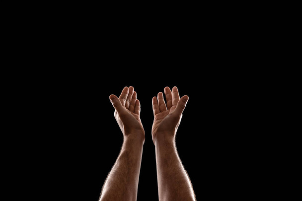 Male hands closeup isolated on black background - Фото, изображение