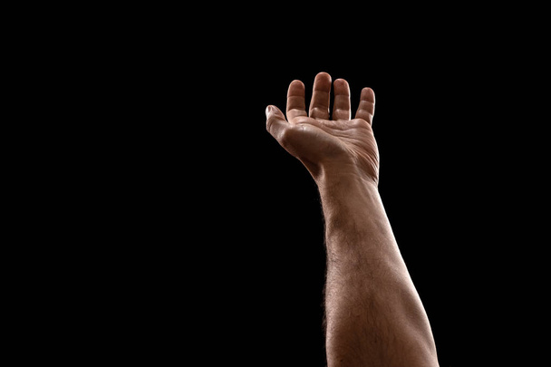 Male hands closeup isolated on black background - Photo, image
