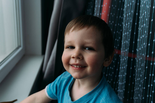 naughty boy smiling at camera, portrait of a child - Photo, Image
