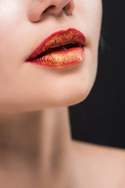 cropped view of naked girl with orange lips isolated on black  - Photo, Image