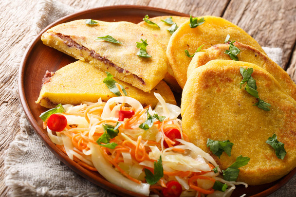 Salvadoran food fried Pupusas served with coleslaw close-up on a - Photo, Image
