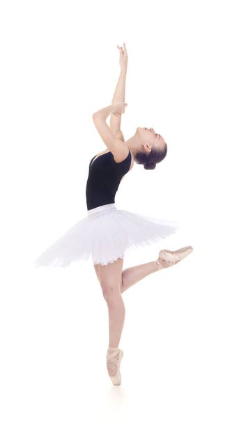Gorgeous ballerina, in a white tutu dancing ballet. - Fotografie, Obrázek