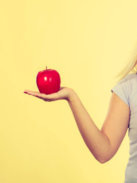 Woman hand holding red apple, healthy food concept - Foto, imagen