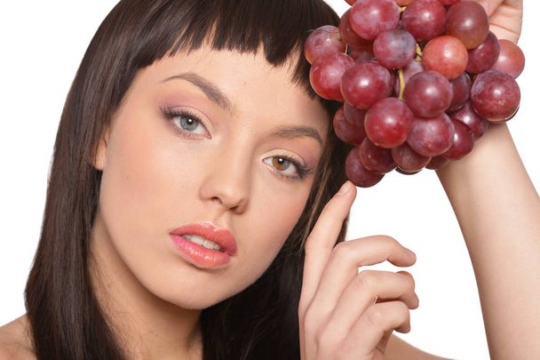 Portrait of young woman posing  with grapes  isolated on white background - Φωτογραφία, εικόνα