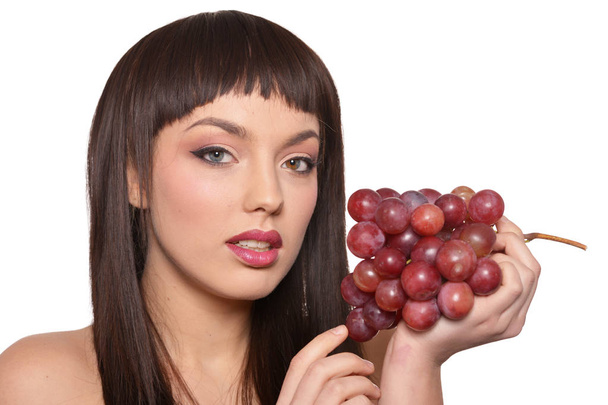 Portrait of young woman posing  with grapes  isolated on white background - Fotoğraf, Görsel