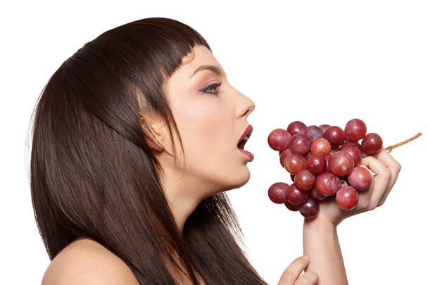 Portrait of young woman posing  with grapes  isolated on white background - Φωτογραφία, εικόνα
