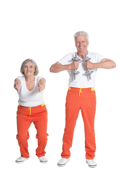 Senior Couple Exercising with dumbbells - Zdjęcie, obraz