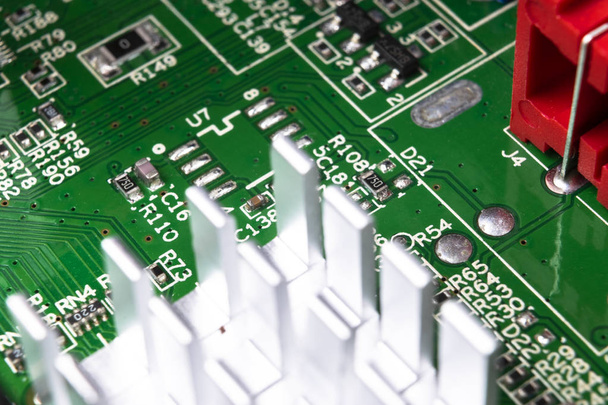 Macro shot of Circuit board with resistors microchips and electronic components. Computer hardware technology. Integrated communication processor. Information engineering. Semiconductor. PCB. Closeup - Φωτογραφία, εικόνα