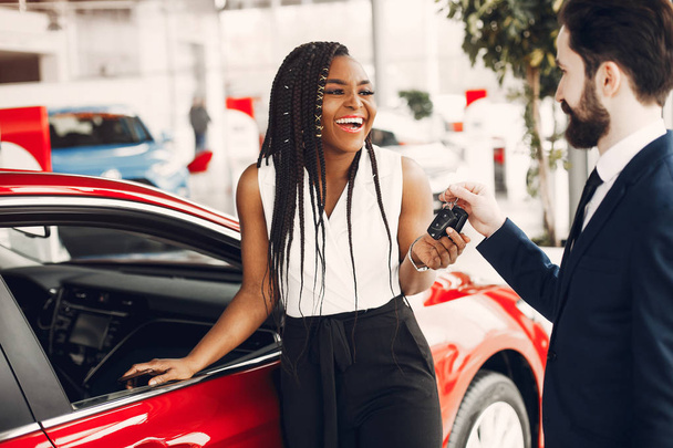Stylish black woman in a car salon - Photo, Image