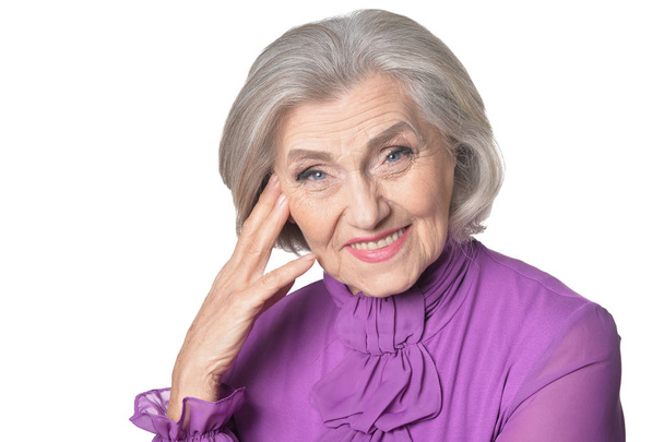 portrait of happy  senior woman posing  against white background - Foto, afbeelding