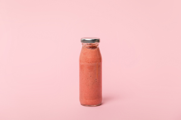 sweet, tasty and fresh smoothie on pink with copy space  - 写真・画像