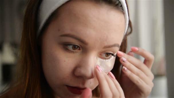 Beauty Skin Care. Beautiful Girl Applying White Nose Patch On Facial Skin. Closeup Young Female Model With Fresh Natural Makeup And Smooth Soft Skin Using Pore Cleansing Strips. - Кадри, відео