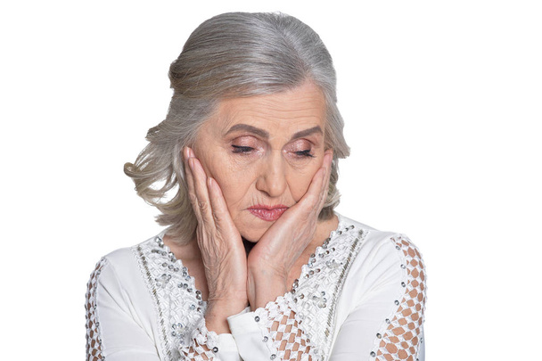 upset mature woman isolated on white background, close up  - Фото, изображение