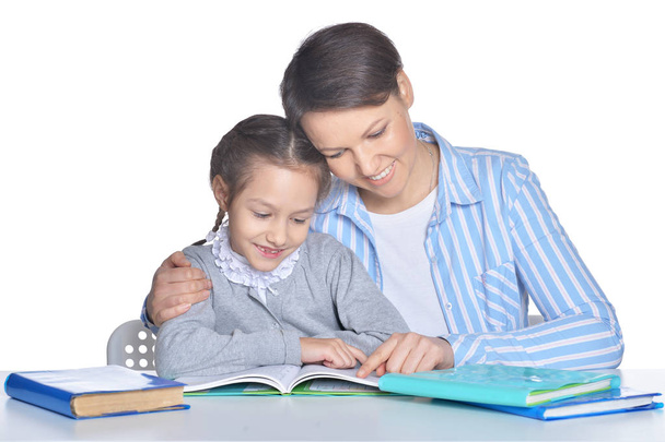 mother with daughter reading books - Φωτογραφία, εικόνα