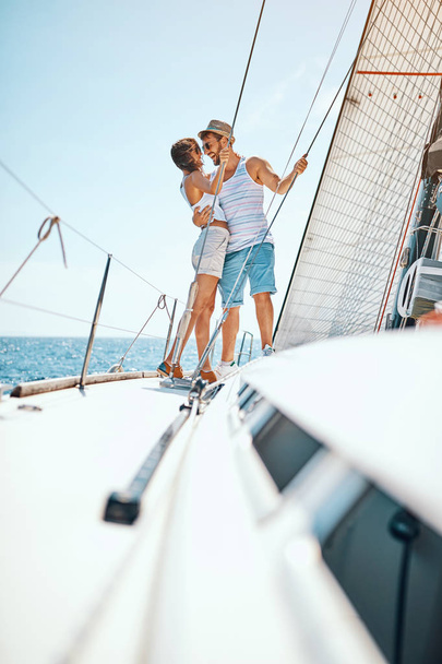 Romantic vacation and luxury travel. Man and woman enjoying on luxury boat - Foto, afbeelding