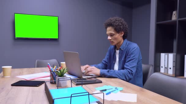 Mixed-race man working on his laptop - Footage, Video