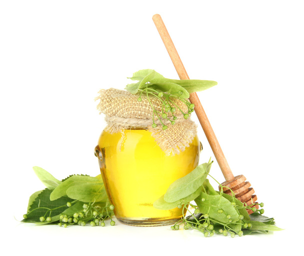Jar of honey with flowers of lime, isolated on white - Valokuva, kuva