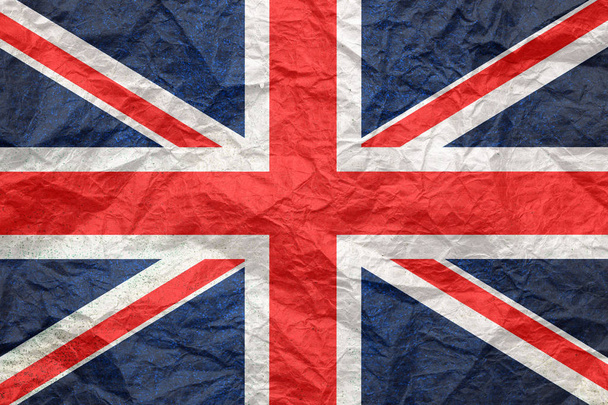 Βρετανική σημαία σε παλιό τσαλακωμένο χαρτί χειροτεχνίας.  - Φωτογραφία, εικόνα