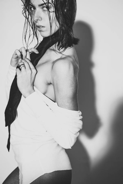 Passionate sexy woman. Seductive and beautiful young woman with tie. Black and white. - Foto, Imagem