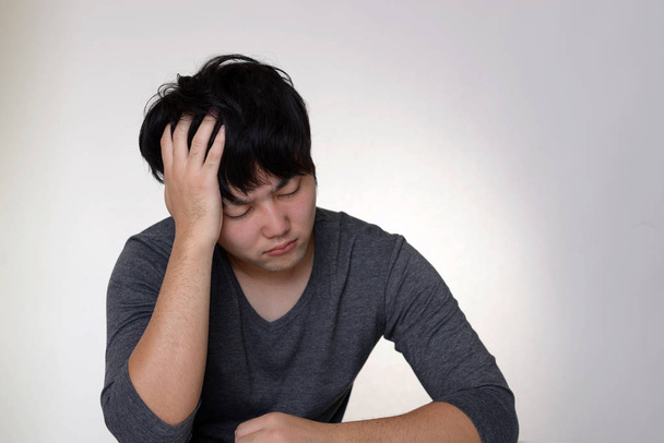 Aziatisch mens in depressie - Foto, afbeelding