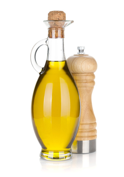 Olive oil bottle and pepper shaker - Фото, изображение