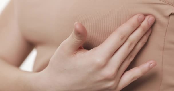 Woman checking her breast for signs of breast cancer. Healthcare and mammology concept. Close up. - Felvétel, videó