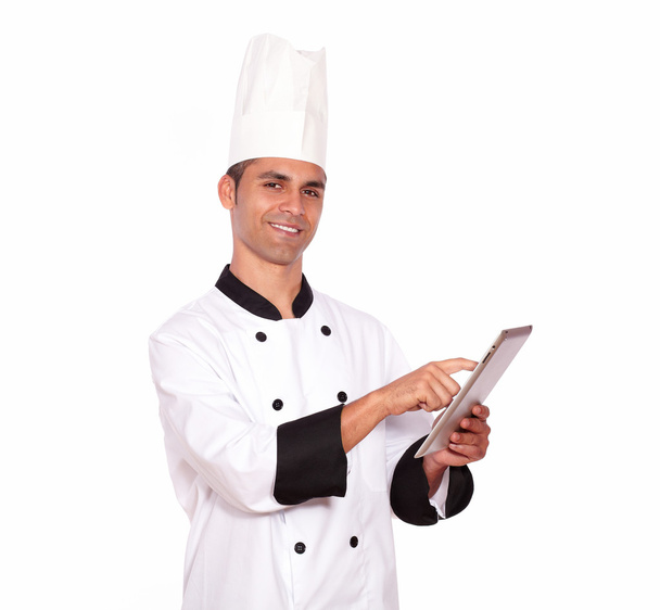 Young male chef using tablet pc - Foto, afbeelding