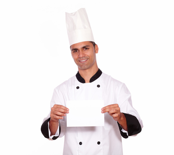Charming male chef holding a white card - Fotoğraf, Görsel