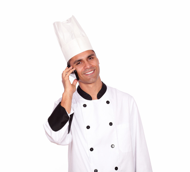 Smiling male chef conversing on cellphone - 写真・画像