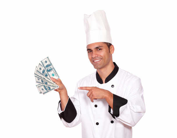 Happy guy in cook uniform holding cash money - Photo, image