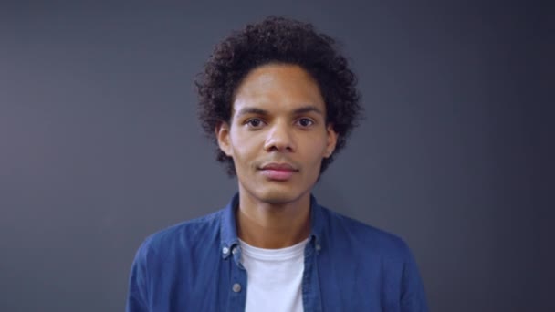Portrait of a smiling mixed race guy - Video, Çekim