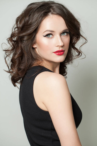 Young woman with makeup and brown hair portrait. Pretty face - Foto, Imagen