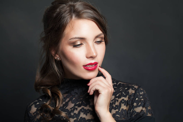 Portrait of beautiful woman with red lips makeup hair on dark  - Fotoğraf, Görsel