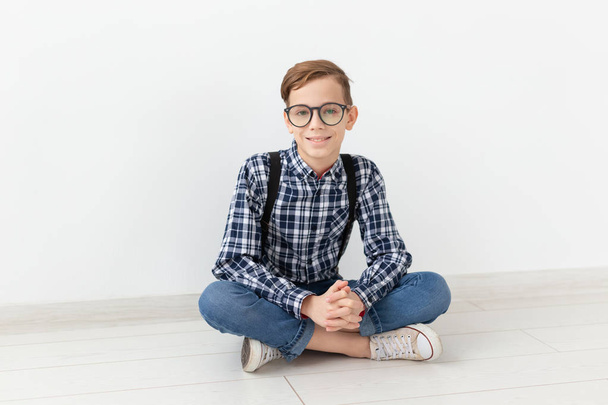 teenager, children and family concept - cute teen boy posing on white background - Fotoğraf, Görsel