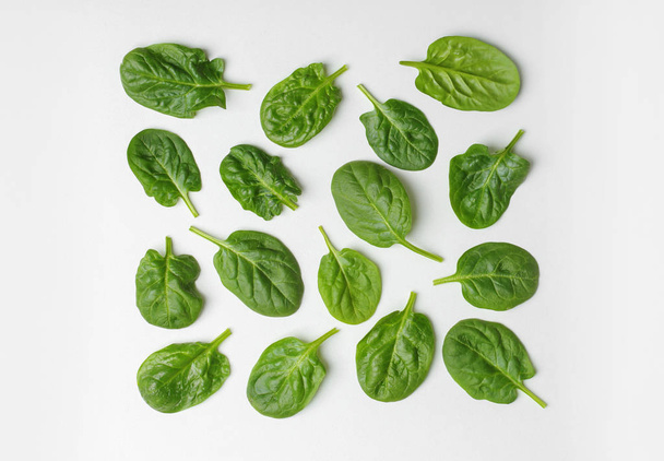 Fresh leaves of spinach isolated on white, top view - Фото, зображення