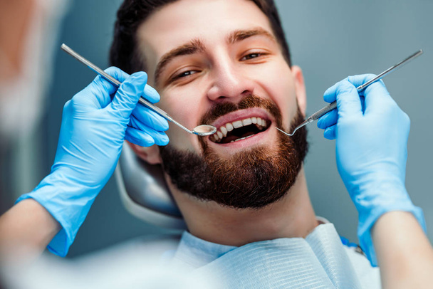 Man having teeth examined at dentists. Close up view. - Foto, Bild