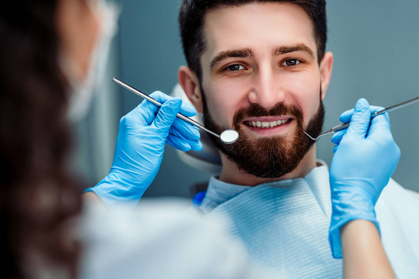 Portrait of male. Smiling face. Dental care concept. Dental inspection. - Foto, imagen