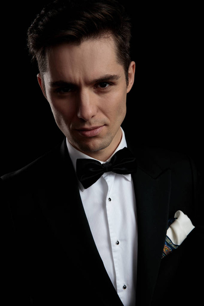 model man in black tuxedo arousing with his look - Valokuva, kuva