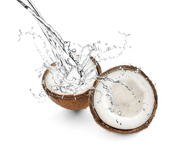 Delicious tropical coconuts and splashing water on white background - Fotografie, Obrázek
