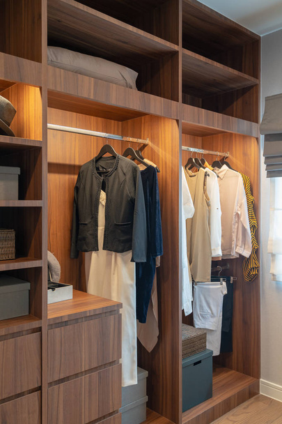 modern closet with clothes hanging - Photo, Image